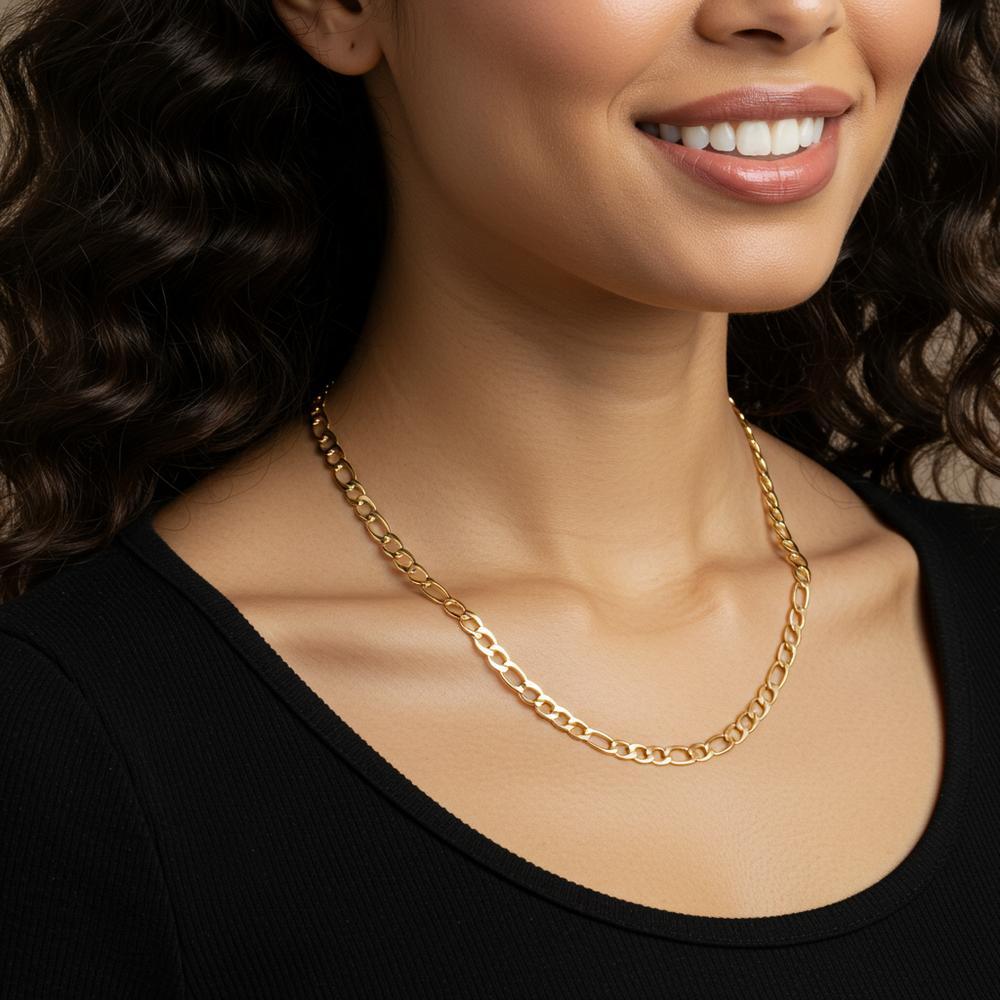 A beautiful selection of flat gold chains including herringbone, curb, and Figaro styles