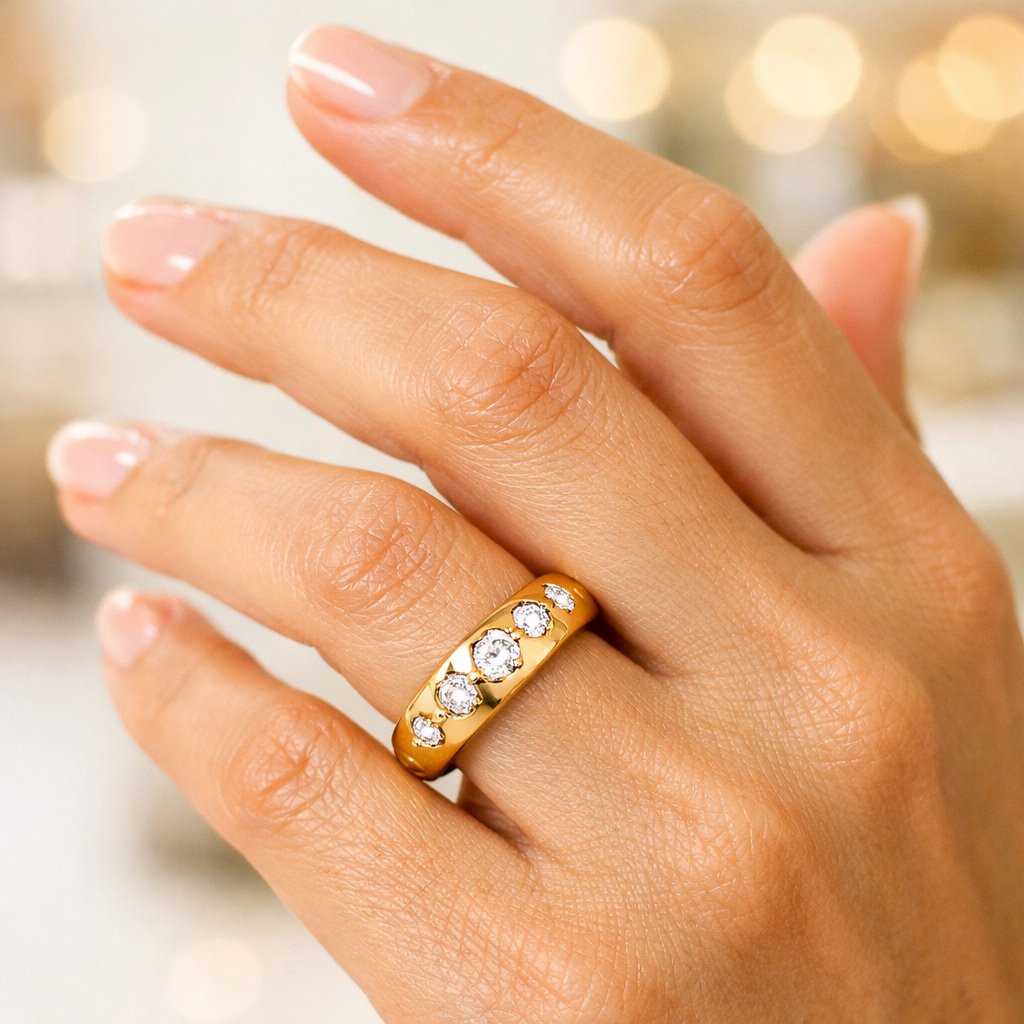 Close-up detail of a gypsy or flush set diamond in a men's wedding band, showcasing the smooth, seamless setting.