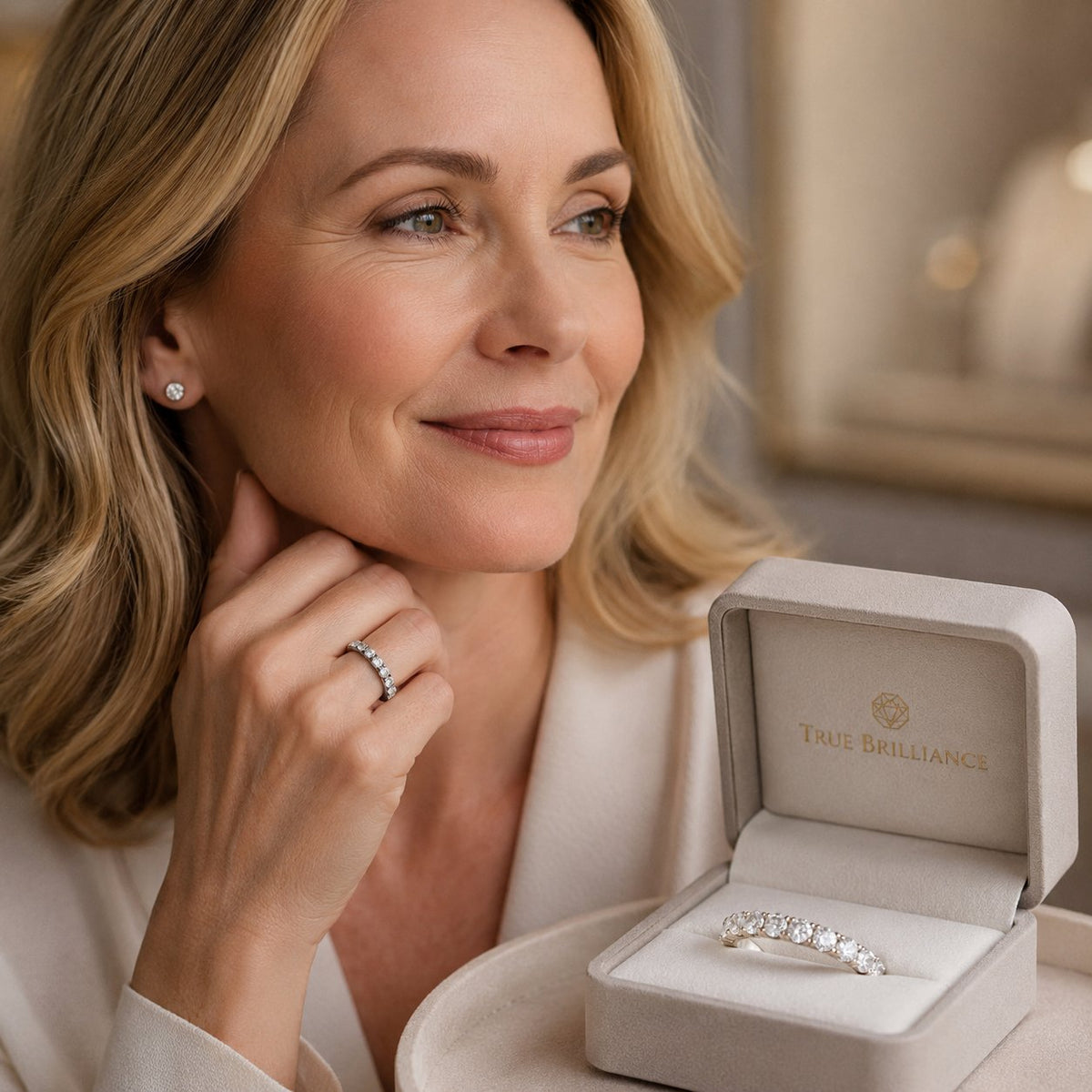 A stunning half-eternity diamond band resting on a white surface, showcasing the brilliant top stones and smooth metal underside for everyday wear and comfort.