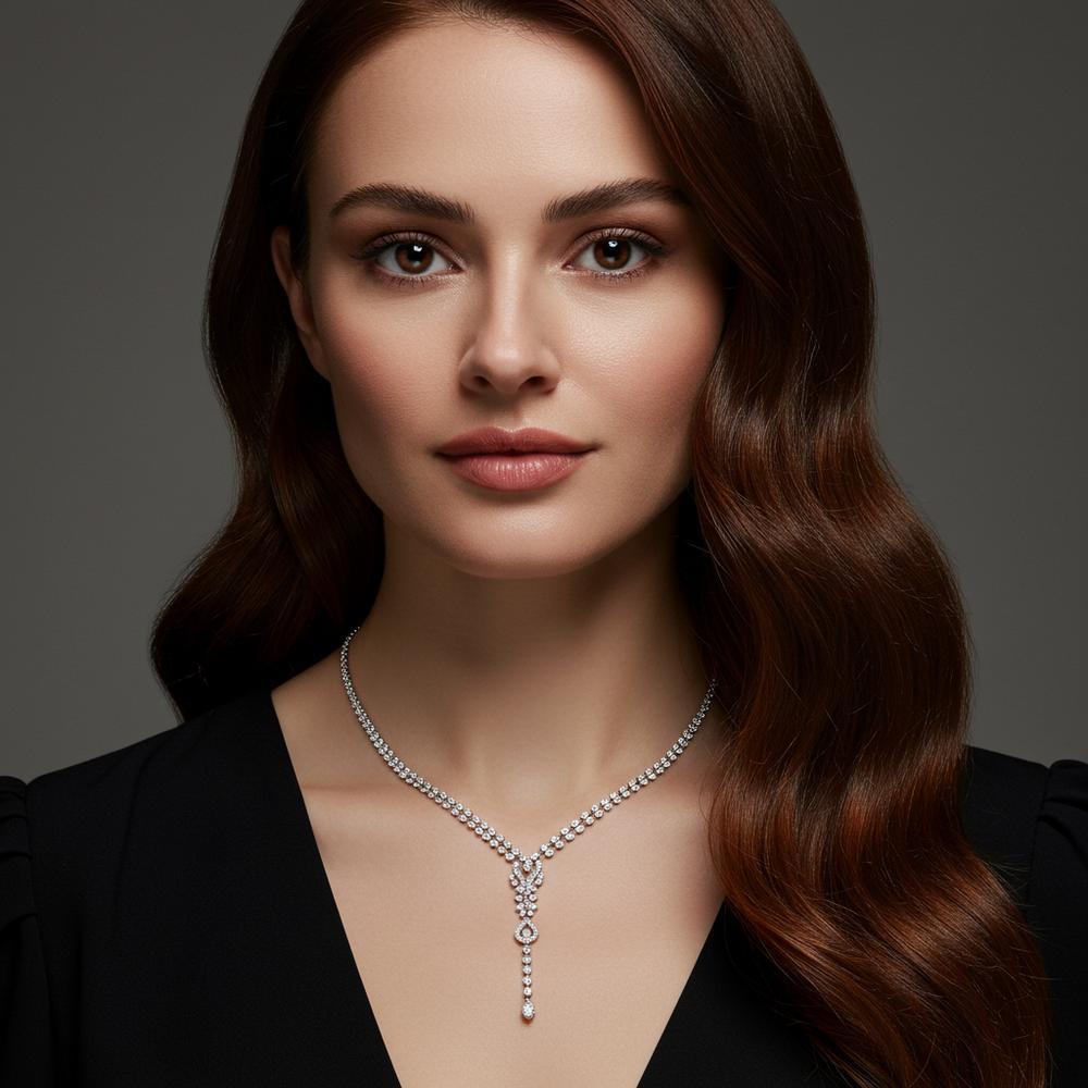 A beautiful vintage lavalier necklace featuring delicate filigree and a gemstone pendant.