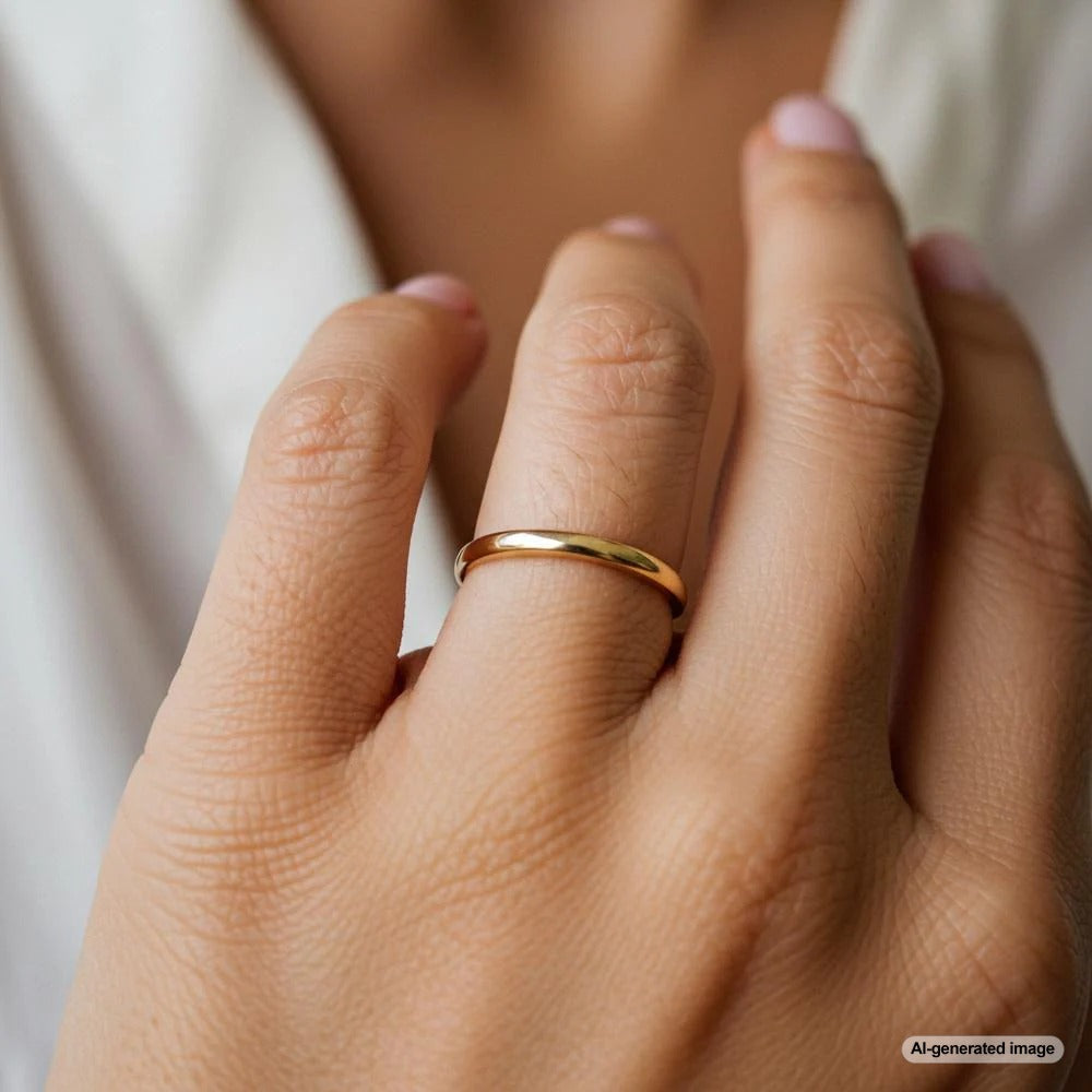 A close-up of a simple gold band being resized, highlighting the ease and precision of the process