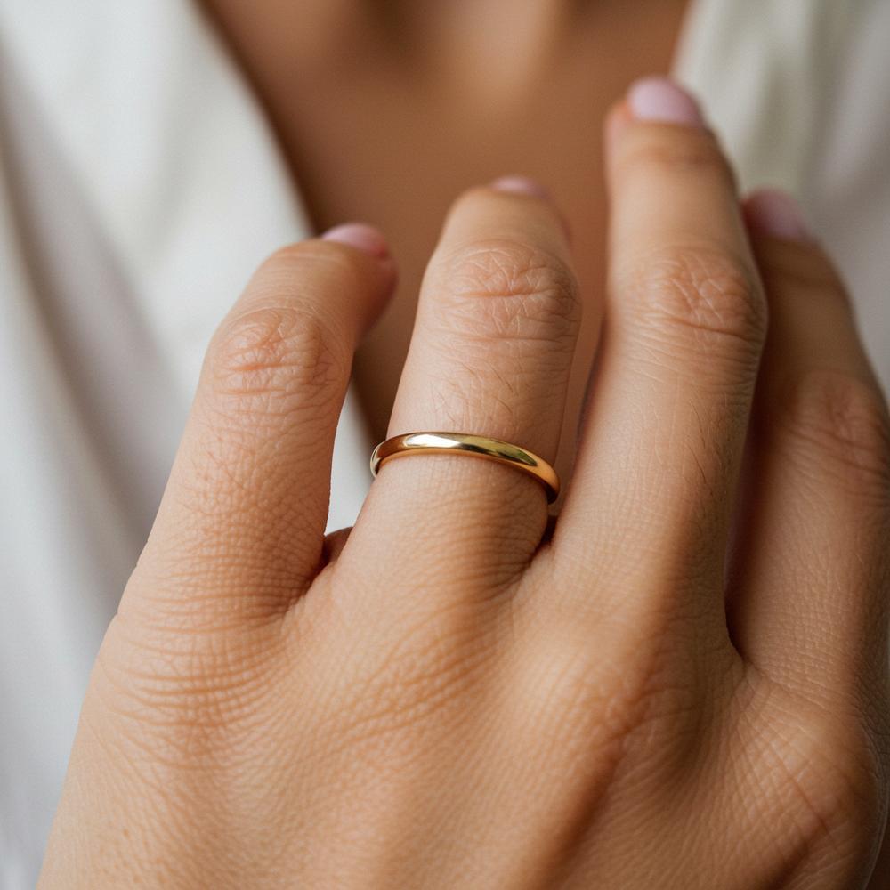 A close-up of a simple gold band being resized, highlighting the ease and precision of the process