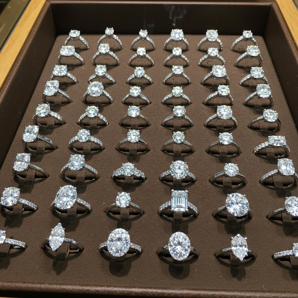 Close-up of various diamond cuts for engagement rings showcasing brilliance and sparkle
