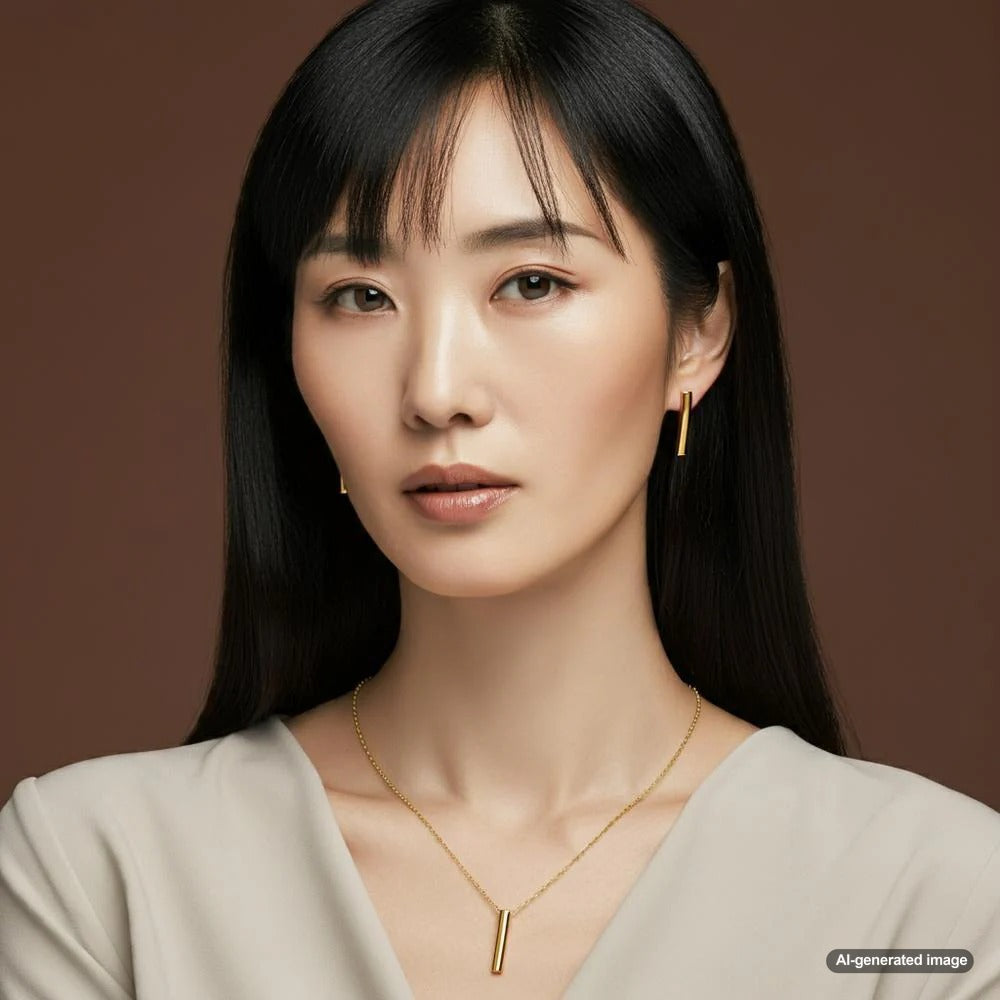 A collection of timeless jewelry pieces including diamond studs, pearl necklace, and gold bracelet.