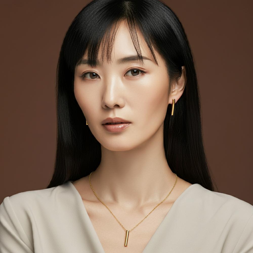 A collection of timeless jewelry pieces including diamond studs, pearl necklace, and gold bracelet.