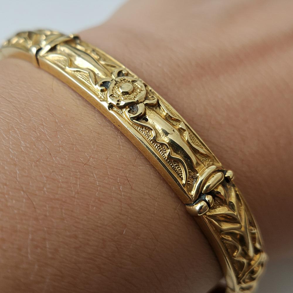 Close-up of tarnished gold jewelry showing discoloration and loss of shine