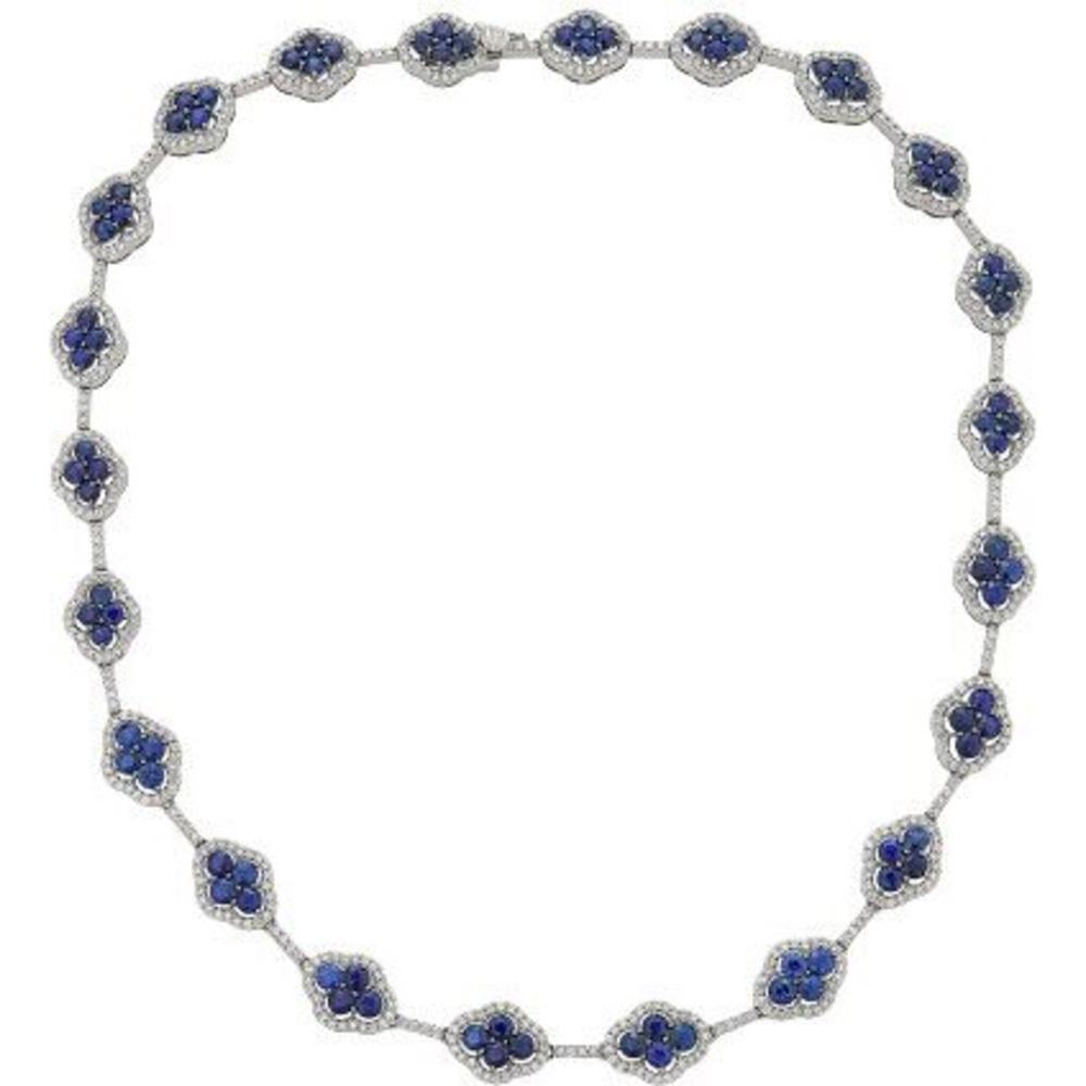 Elegant sapphire jewelry showcasing a blue sapphire ring, necklace, and earrings
