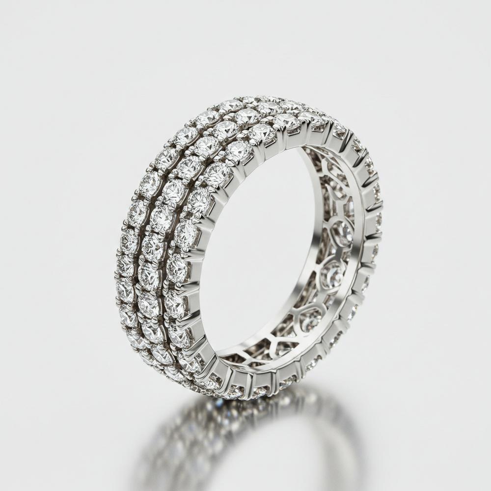 Various rings that cannot be resized including eternity bands and tungsten rings displayed on a velvet jewelry tray