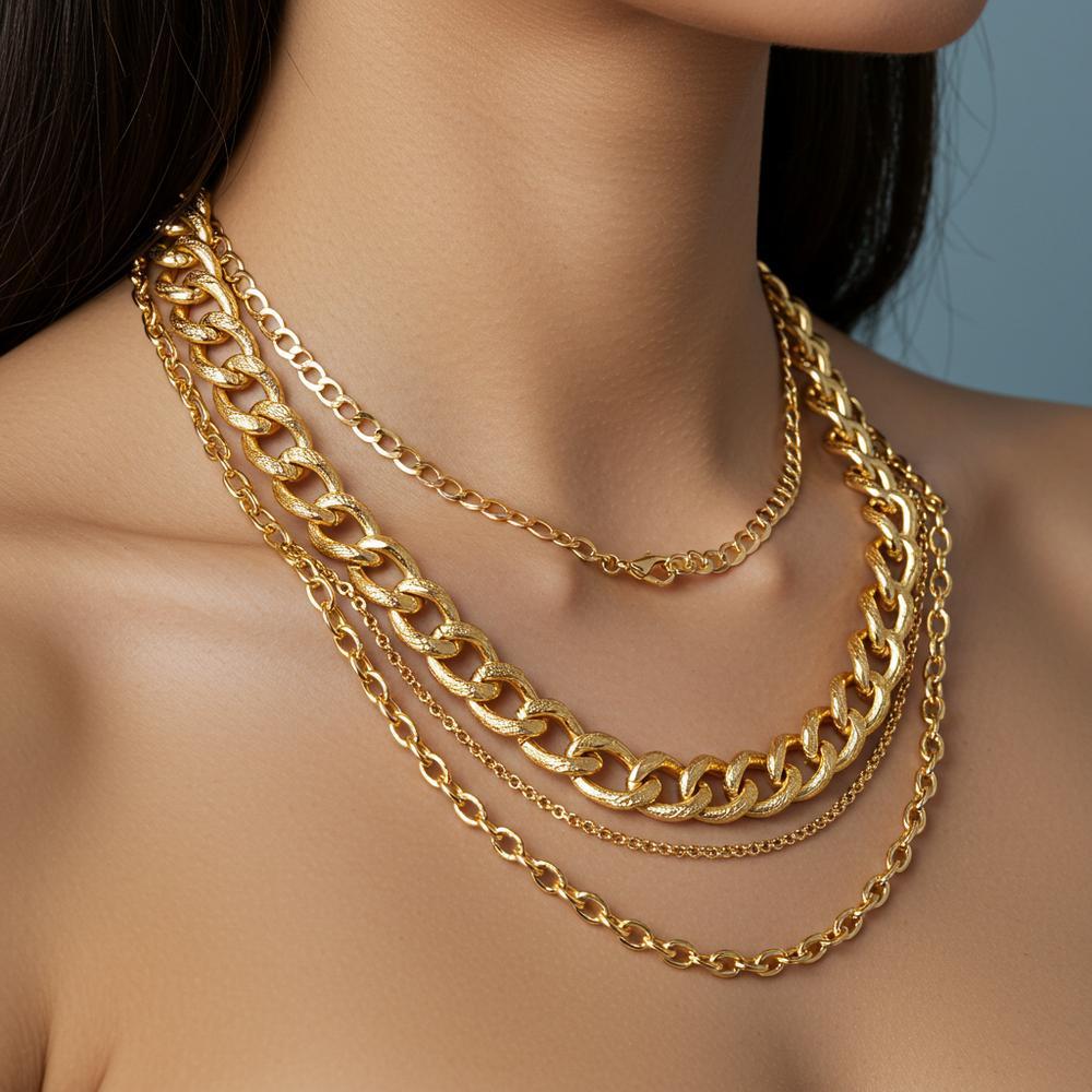 Comparison of 14k and 24k gold jewelry showcasing their differences in color and shine