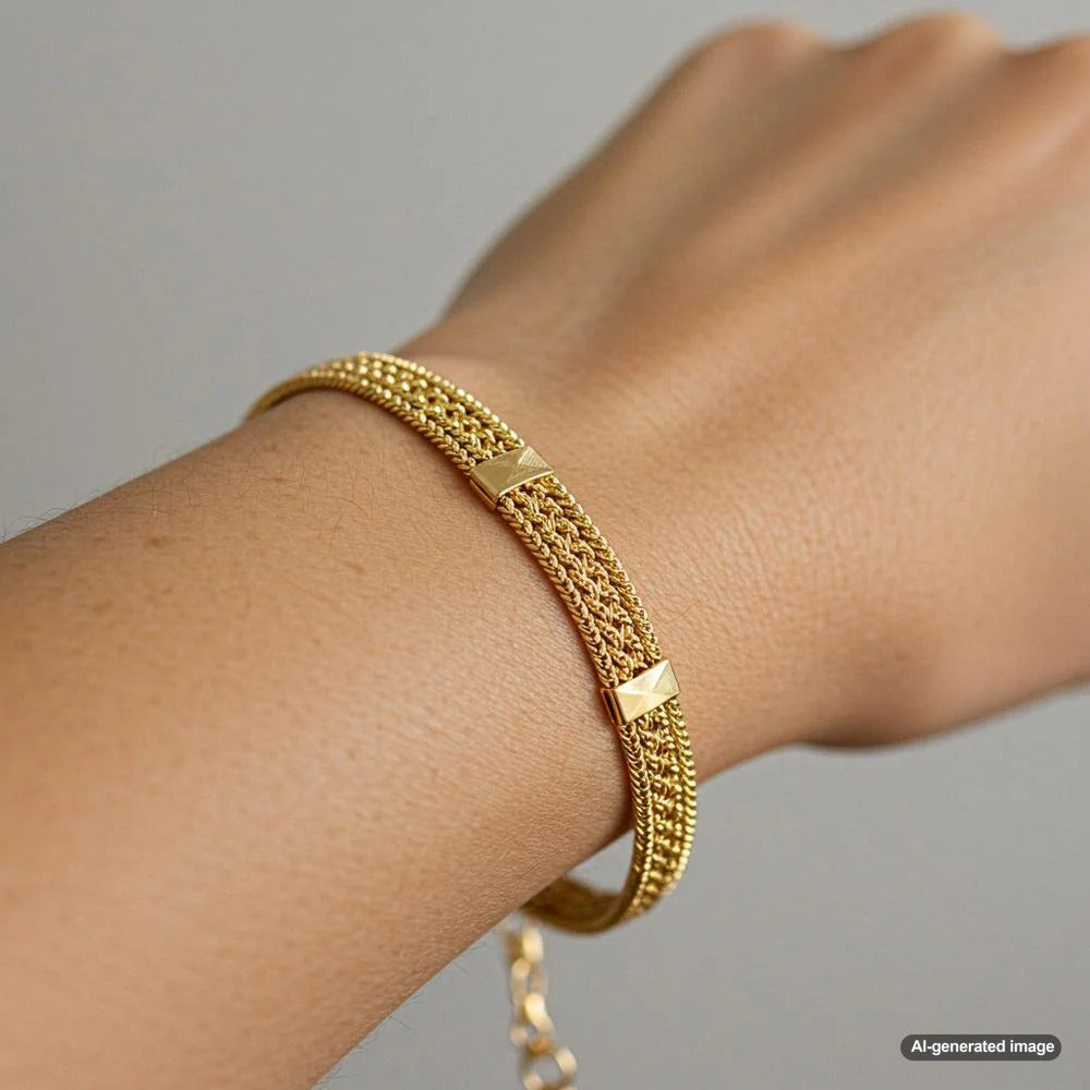 A stunning gold bracelet elegantly displayed on a wrist