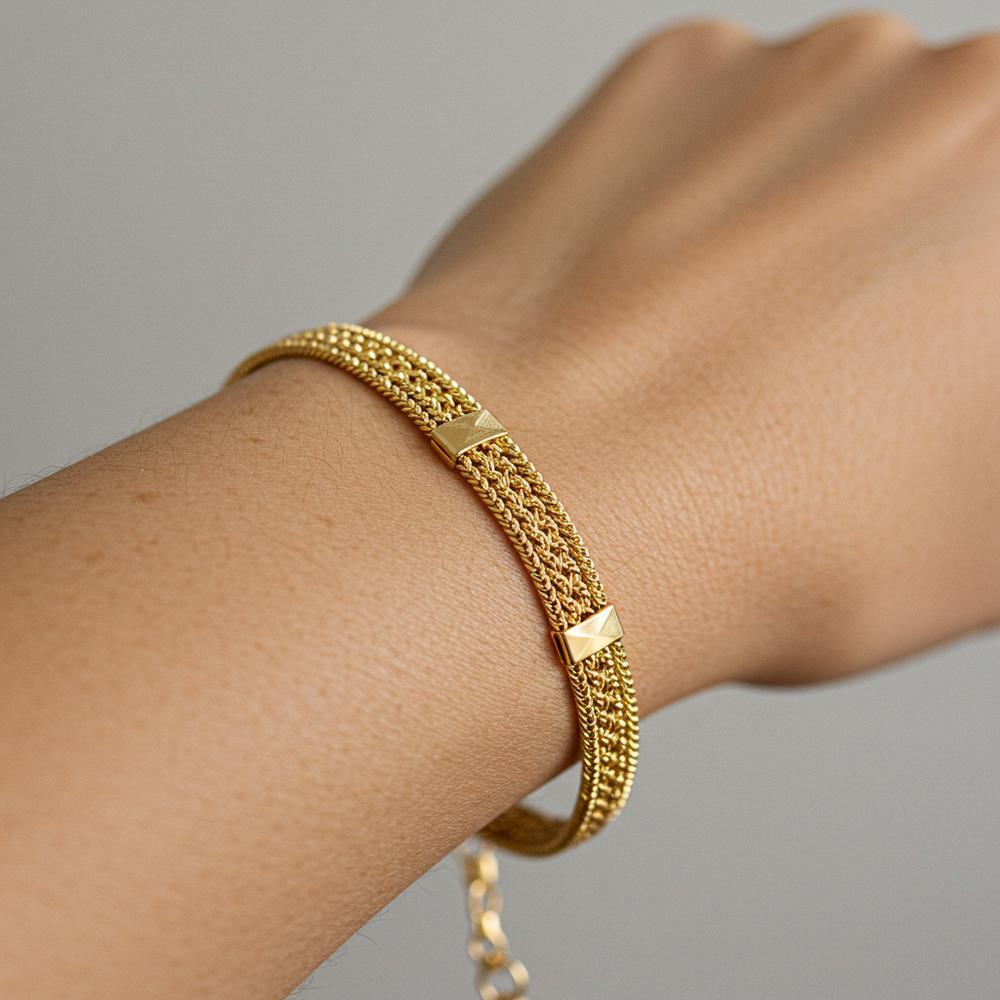 A stunning gold bracelet elegantly displayed on a wrist