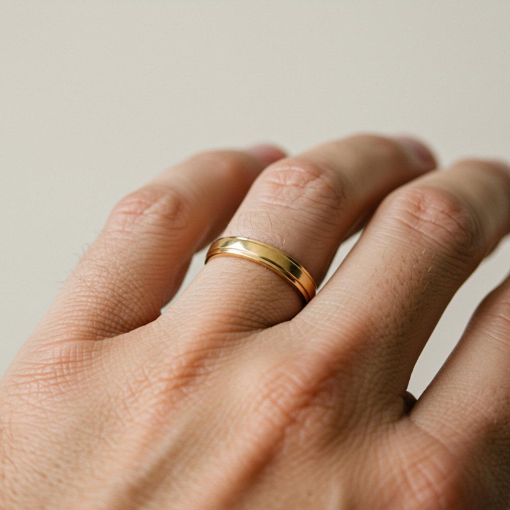 Elegant wedding bands displayed on a velvet tray, showcasing classic gold and diamond designs