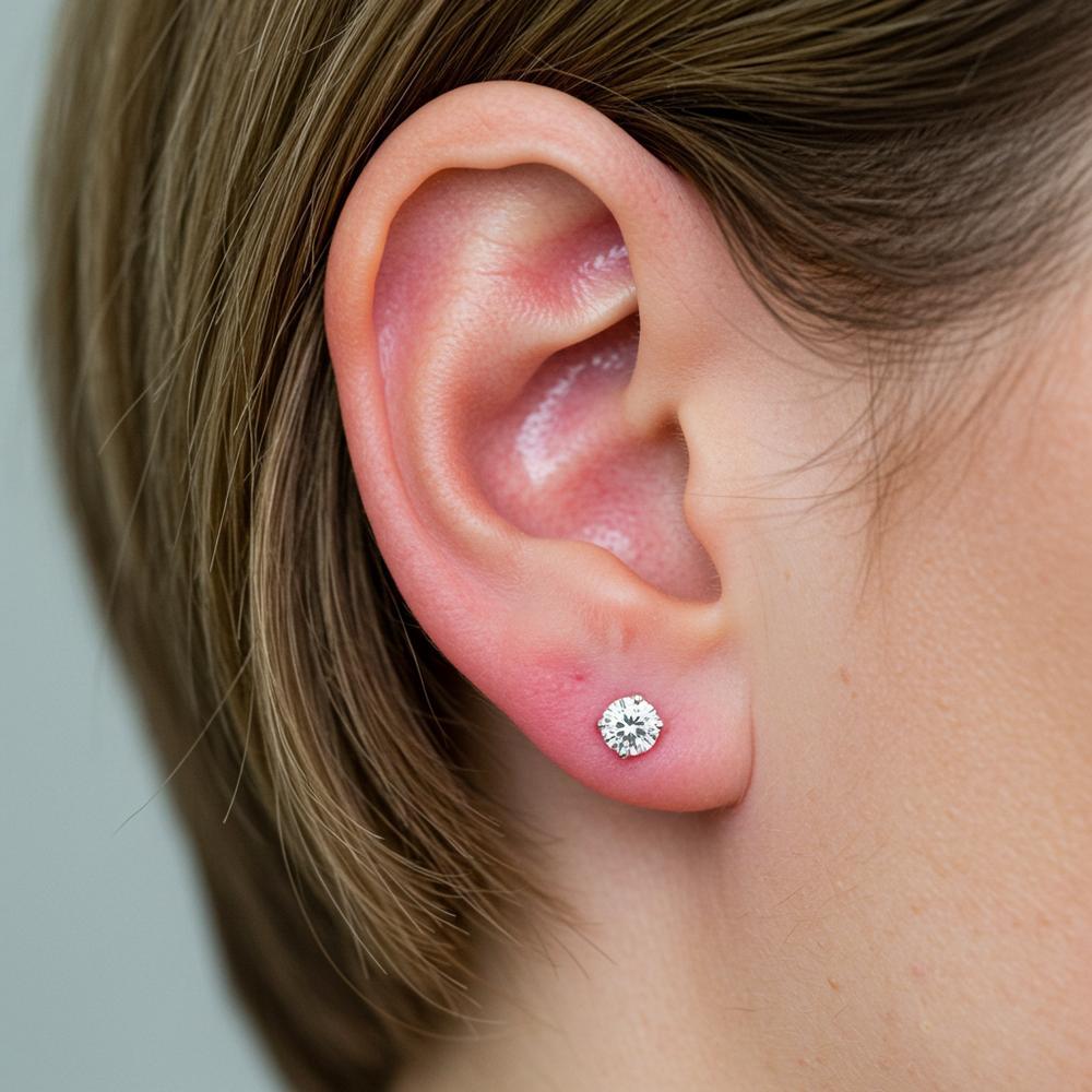 Woman touching her ear with irritation, showcasing earring sensitivity