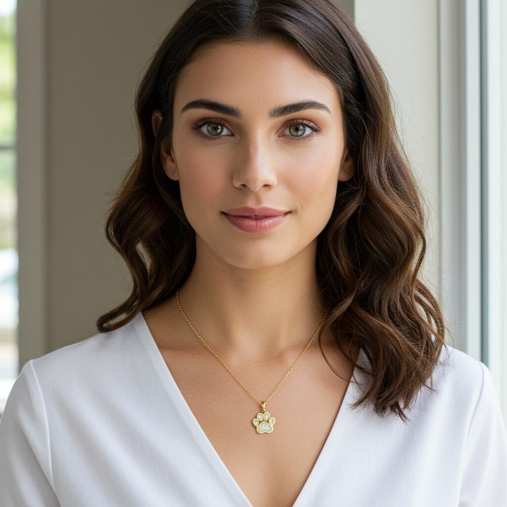Close-up of elegant paw print pendant necklace in rose gold with diamond accents