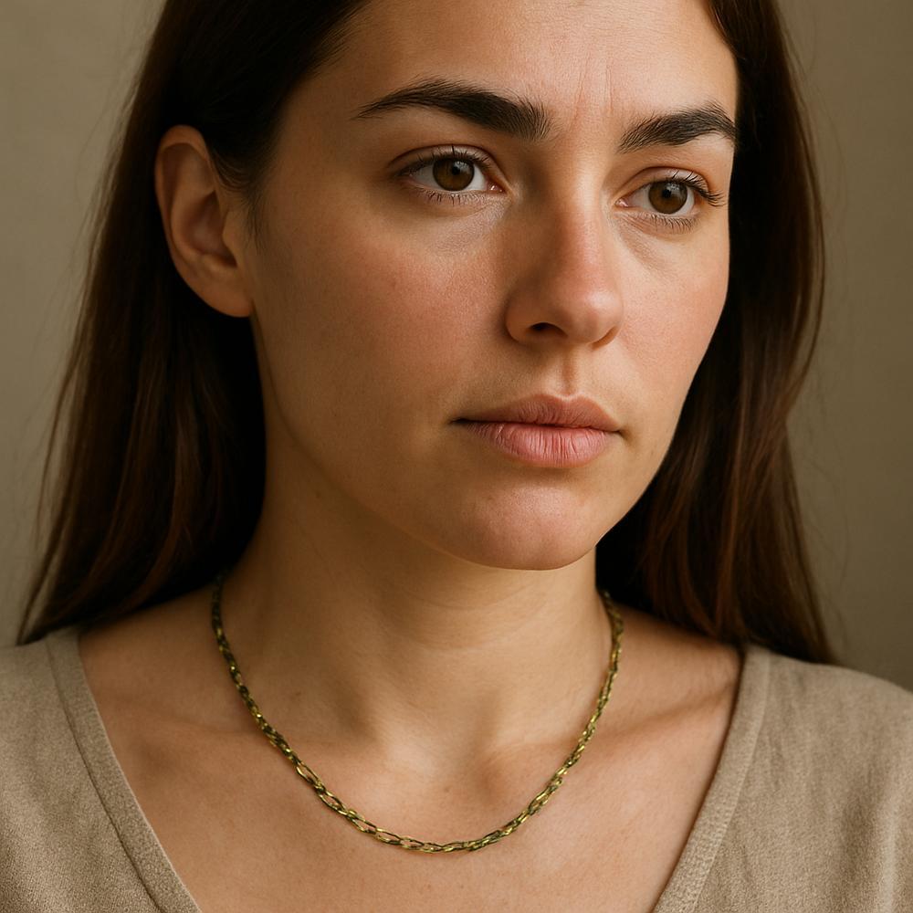 Close-up of a necklace chain turning green due to oxidation