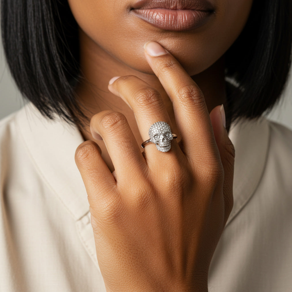 Luxury skull jewelry collection featuring diamond-encrusted skull rings and pendants from Robinson's Jewelers