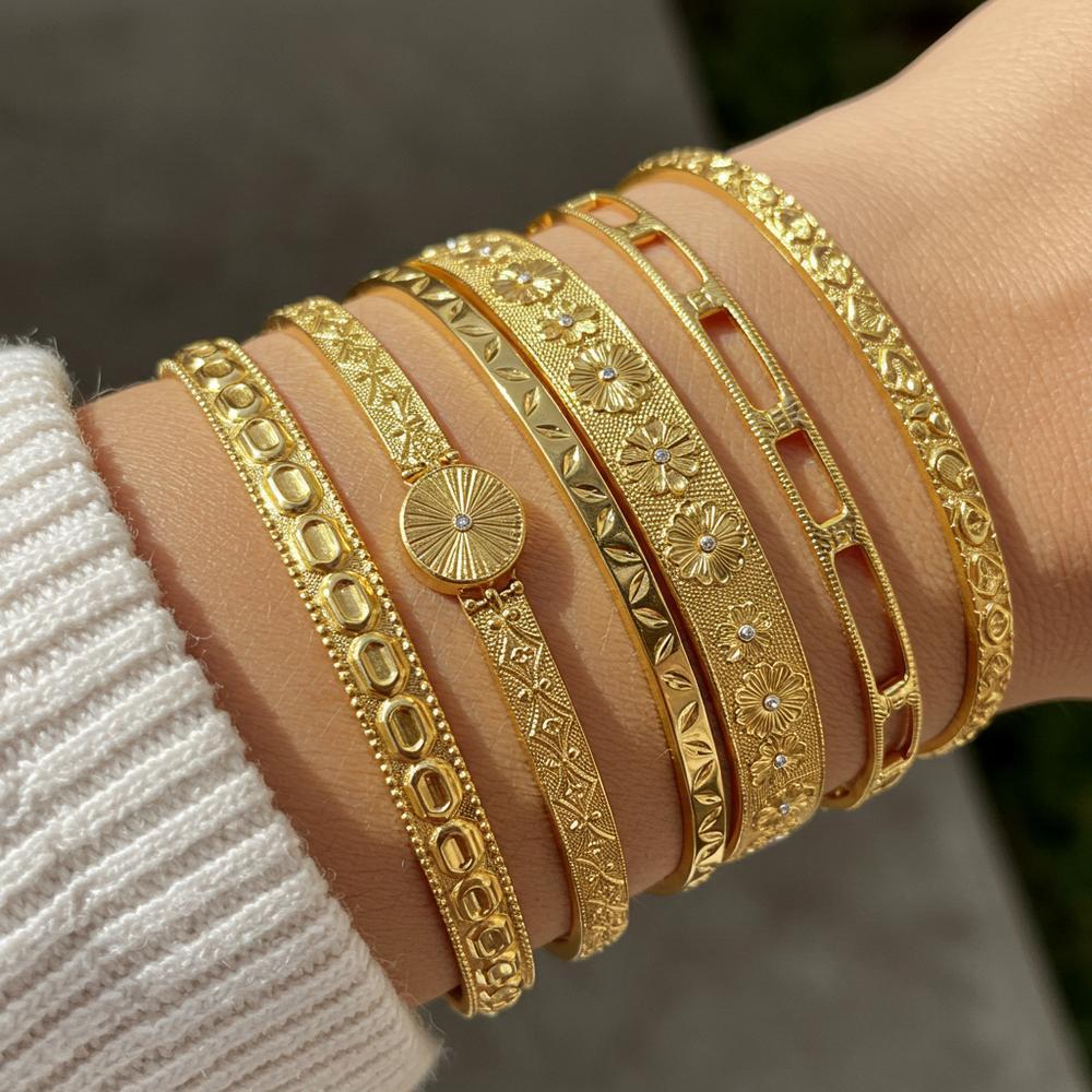 Elegant gold jewelry pieces showcasing necklaces, bracelets, and rings