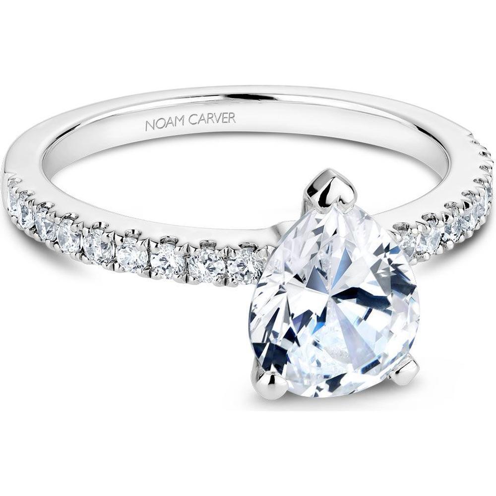 A stunning pear-shaped diamond engagement ring set in a delicate rose gold band, showcasing its unique teardrop shape and brilliant sparkle.