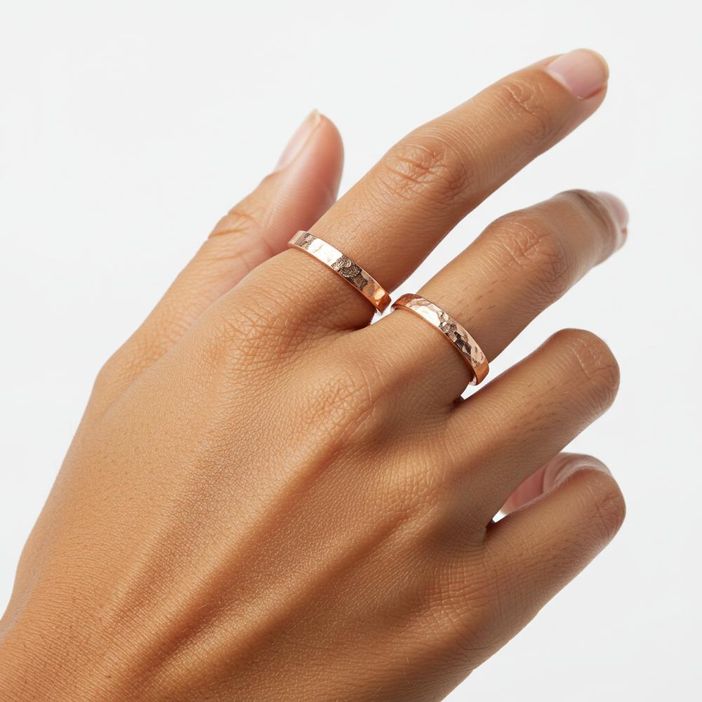 A beautiful rose gold ring set against a soft neutral background