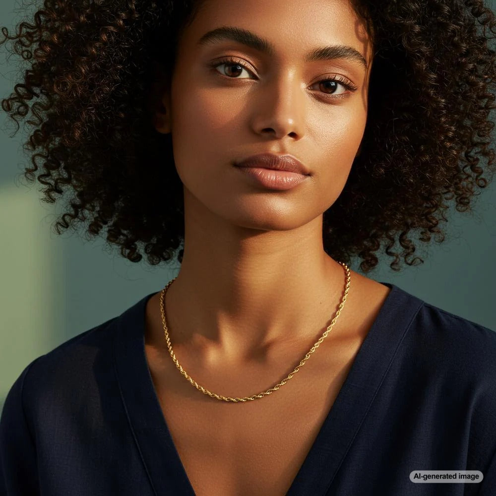 Close-up of a gold rope chain with intricate twists, reflecting light elegantly