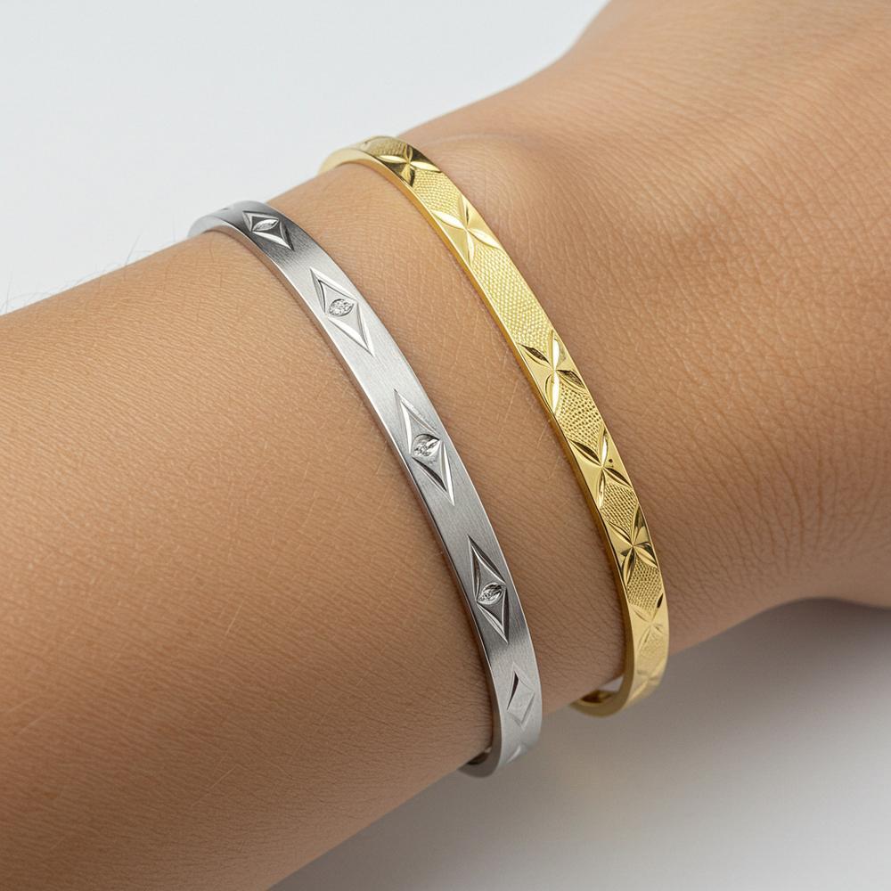 Yellow gold and white gold rings side by side, showcasing the difference in color and style