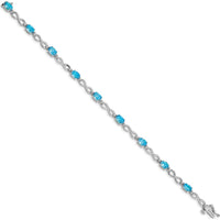 10K White Gold Blue Topaz and Diamond Infinity Bracelet - 7in Length by Oro Pregiato