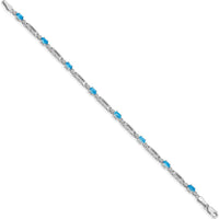10K White Gold Bracelet with Oval Swiss Blue Topaz and Round Diamond Accents - 0.30 Carats Total Gem Weight by Monteluci Fine Jewelry