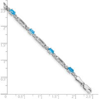 10K White Gold Bracelet with Oval Swiss Blue Topaz and Round Diamond Accents - 0.30 Carats Total Gem Weight by Monteluci Fine Jewelry