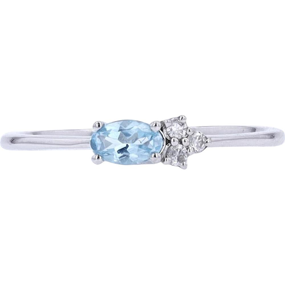 10K White Gold Oval Blue Topaz and Diamond Accent Ring - 0.04 Carat Total Diamond Weight