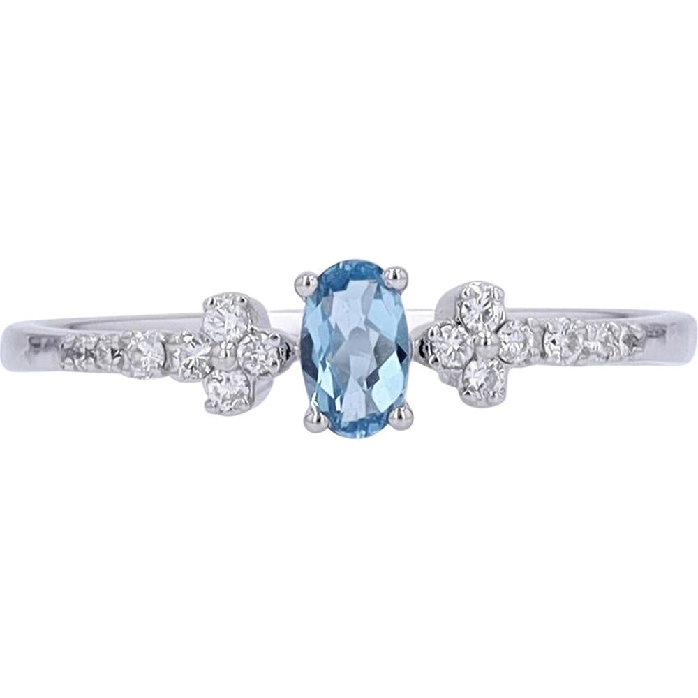 10K White Gold Oval Blue Topaz and Diamond Accent Ring - 0.10 Carats Total Diamond Weight