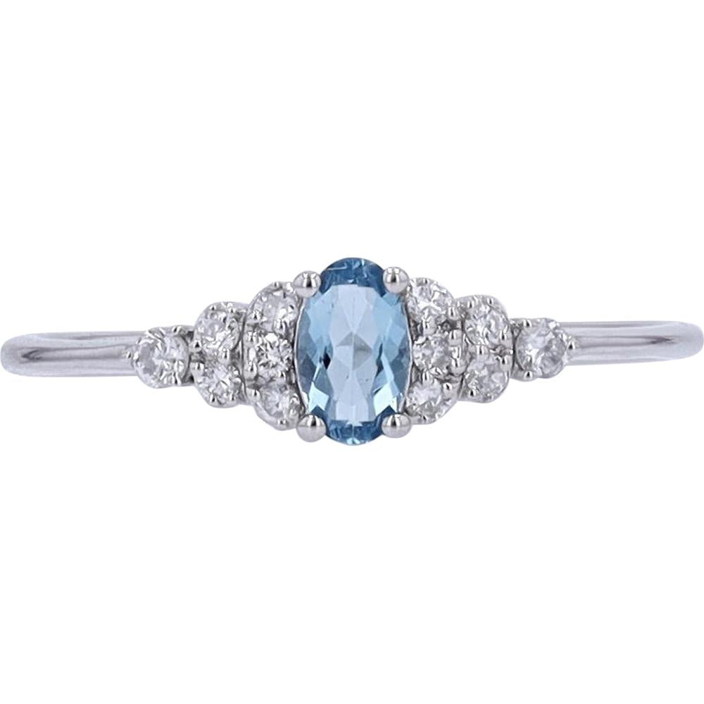 10K White Gold Oval Blue Topaz Ring with Round Diamond Accents - 0.11 Carat Total Diamond Weight