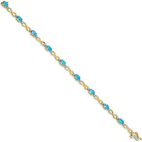 10K Yellow Gold Swiss Blue Topaz and Diamond Infinity Bracelet - 0.56 Carats Total Topaz Weight by Monteluci Fine Jewelry