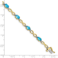 10K Yellow Gold Swiss Blue Topaz and Diamond Infinity Bracelet - 0.56 Carats Total Topaz Weight by Monteluci Fine Jewelry