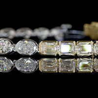 14K Two Tone 7.81 Carat Tennis Bracelet with East-West Oval and Emerald Cut Lab Diamonds in Half Bezel Settings - Covaloro Fine Jewelry
