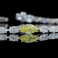 14K Two Tone 7" Tennis Bracelet with East-West Marquise Cut Lab Diamonds Including a 0.38 Carats Fancy Vivid Yellow Center Stone - 4.4 Carats Total Diamond Weight - Covaloro Fine Jewelry