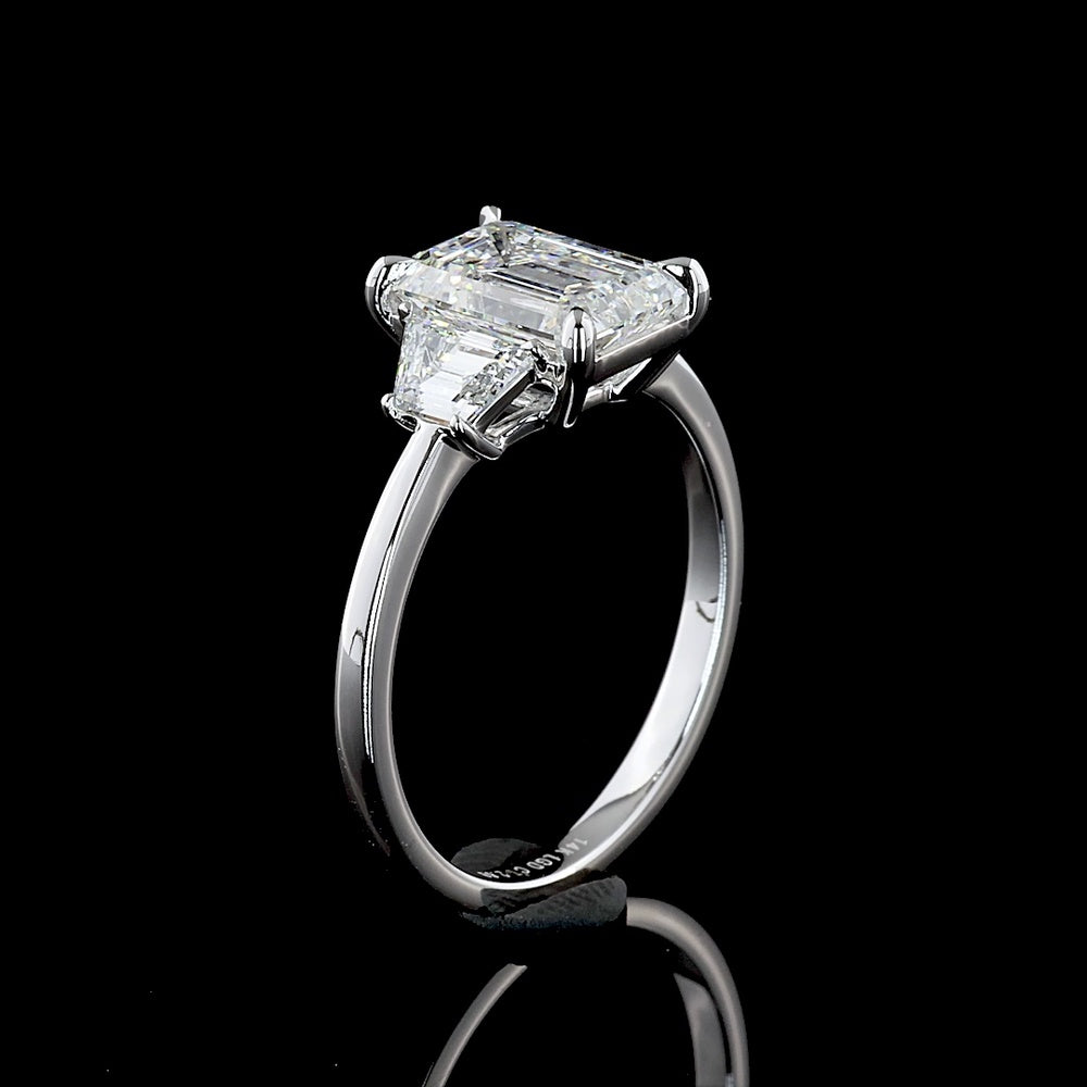 14K White Gold 3-Stone Ring with 2.12 Carat Emerald Cut Lab Diamond and Trapezoid Side Stones - 2.67 Carat Total Diamond Weight - Covaloro Fine Jewelry
