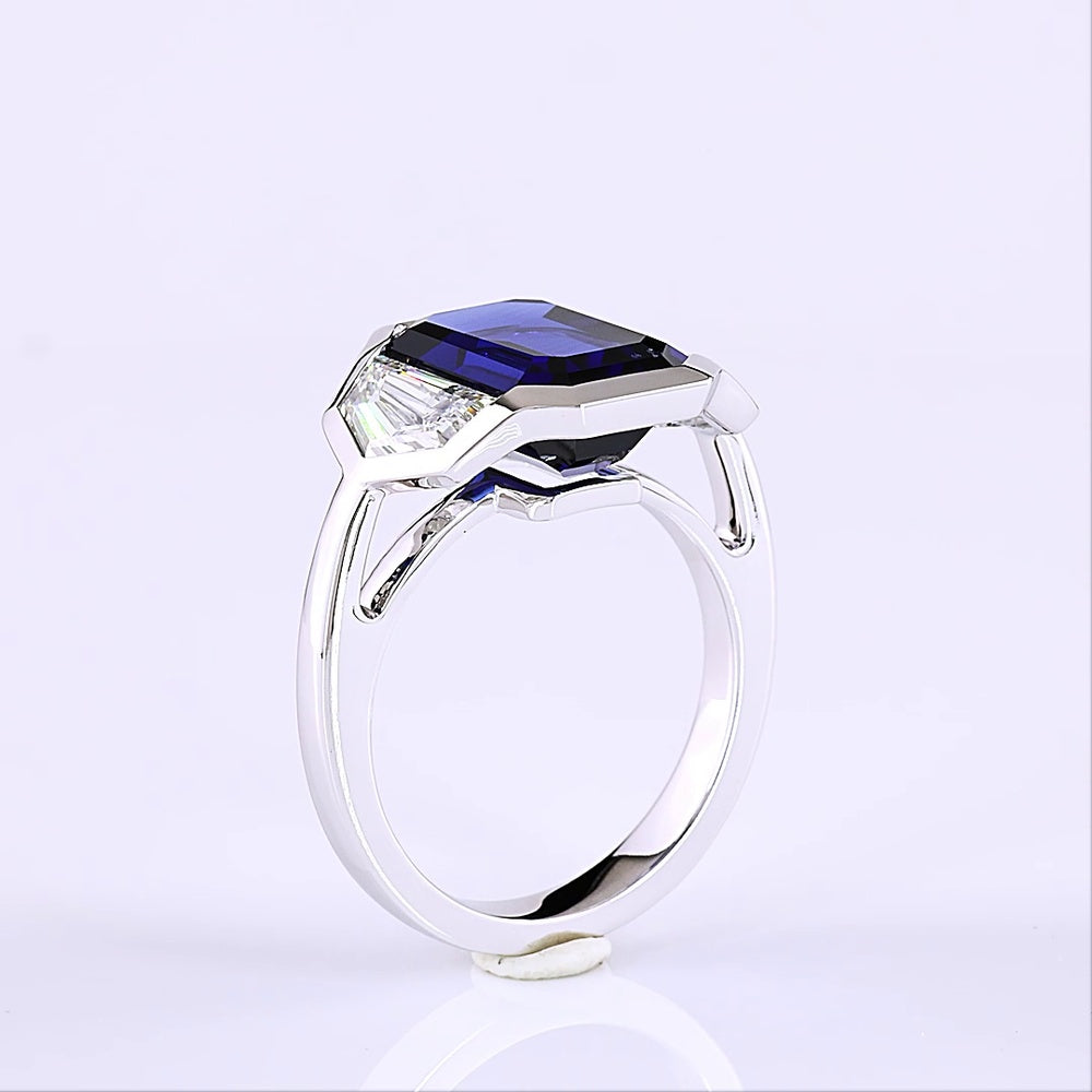 14K White Gold 3-Stone Ring with 6.48 Carats Emerald Cut Lab Blue Sapphire and 1.84 Carats Emerald Cut Lab Diamonds in Half-Bezel Setting - 8.32 Carats Total Gem Weight - Covaloro Fine Jewelry