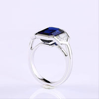 14K White Gold 3-Stone Ring with 6.48 Carats Emerald Cut Lab Blue Sapphire and 1.84 Carats Emerald Cut Lab Diamonds in Half-Bezel Setting - 8.32 Carats Total Gem Weight - Covaloro Fine Jewelry