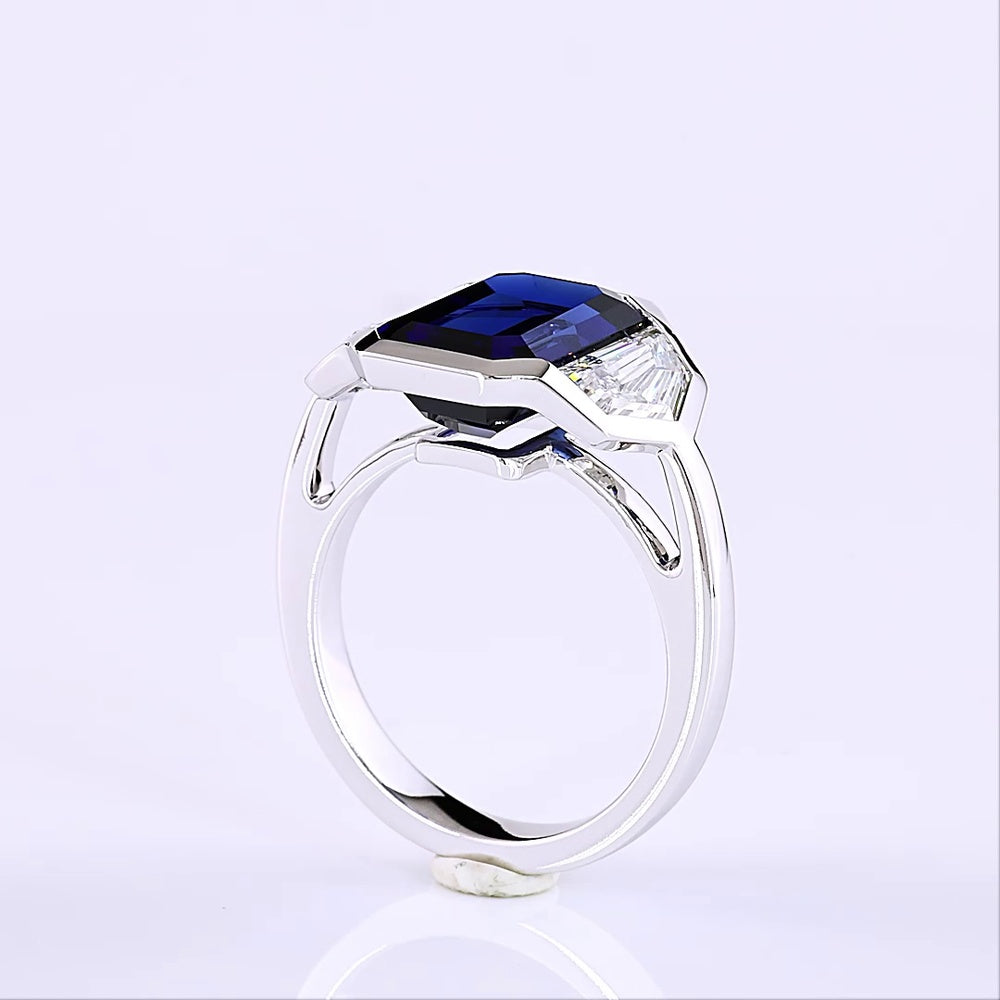 14K White Gold 3-Stone Ring with 6.48 Carats Emerald Cut Lab Blue Sapphire and 1.84 Carats Emerald Cut Lab Diamonds in Half-Bezel Setting - 8.32 Carats Total Gem Weight - Covaloro Fine Jewelry