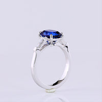 14K White Gold 3-Stone Ring with Cushion Brilliant Cut Lab-Grown Blue Sapphire and Tapered Baguette Diamonds - 3.72 Carat Total Gem Weight - Covaloro Fine Jewelry