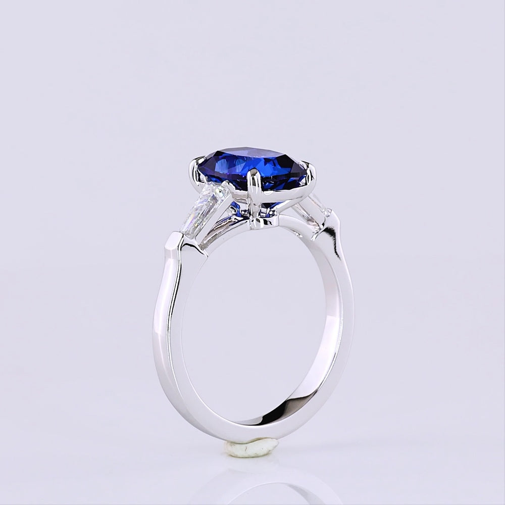 14K White Gold 3-Stone Ring with Cushion Brilliant Cut Lab-Grown Blue Sapphire and Tapered Baguette Diamonds - 3.72 Carat Total Gem Weight - Covaloro Fine Jewelry