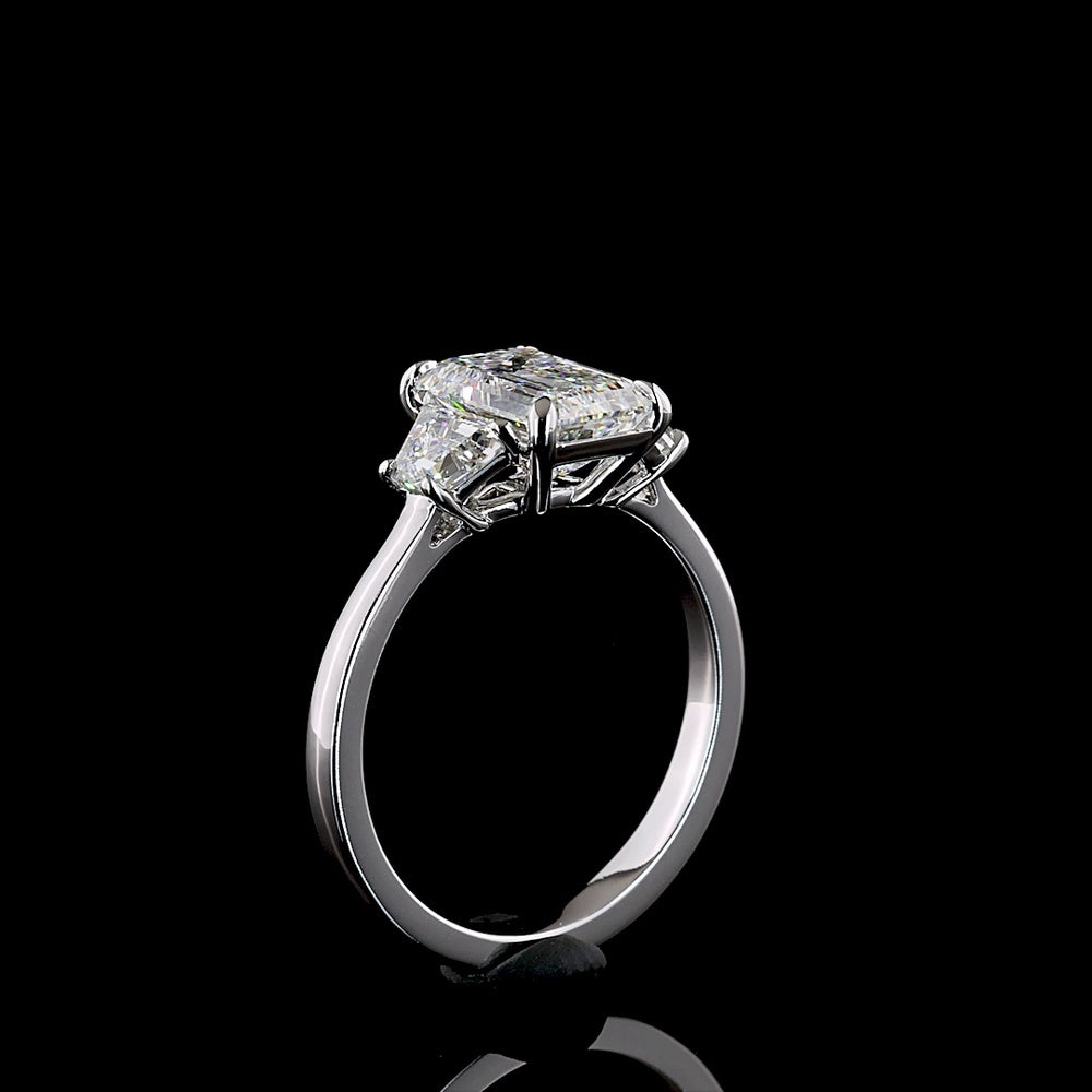 14K White Gold 3-Stone Ring with Emerald Cut Lab Diamond Center (2.07ct) and Trapezoid Side Stones (0.66ct) - 2.73 Carat Total Weight, E-F Color VS1 Clarity - Covaloro Fine Jewelry