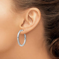 14K White Gold 32.5mm Polished Round Omega Back Hoop Earrings by Monteluci Fine Jewelry