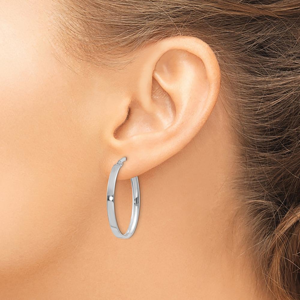 14K White Gold 3mm Oval Hoop Earrings with Polished Finish and Rhodium Plating by Monteluci Fine Jewelry