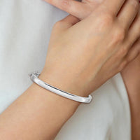 14K White Gold 5.3mm Polished Solid Hinged Oval Bangle Bracelet with Box Catch and Safety Clasp by Oro Pregiato