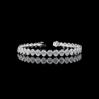 14K White Gold 7.5" Tennis Bracelet with 34 Bezel Set Oval Cut Lab Diamonds - 10.74 Carat Total Weight with E-F Color and VS1 Clarity - Covaloro Fine Jewelry