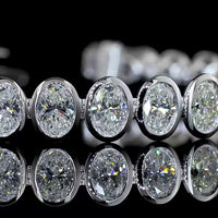 14K White Gold 7.5" Tennis Bracelet with 34 Bezel Set Oval Cut Lab Diamonds - 10.74 Carat Total Weight with E-F Color and VS1 Clarity - Covaloro Fine Jewelry