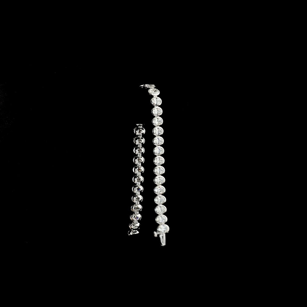 14K White Gold 7.5" Tennis Bracelet with 34 Bezel Set Oval Cut Lab Diamonds - 10.74 Carat Total Weight with E-F Color and VS1 Clarity - Covaloro Fine Jewelry