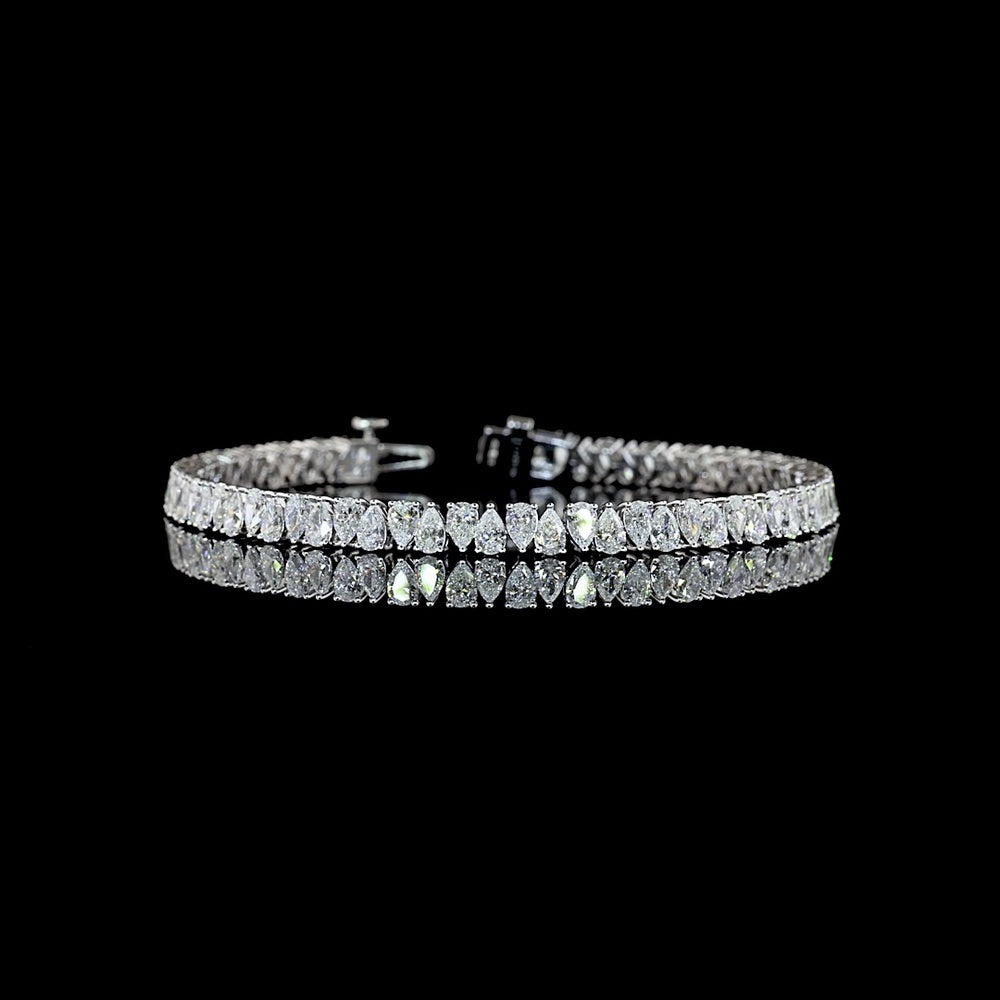 14K White Gold 7.54 Carat Tennis Bracelet with Prong Set Pear Cut Natural Diamonds (E-F Color, VS+ Clarity, 70 Stones) - Covaloro Fine Jewelry
