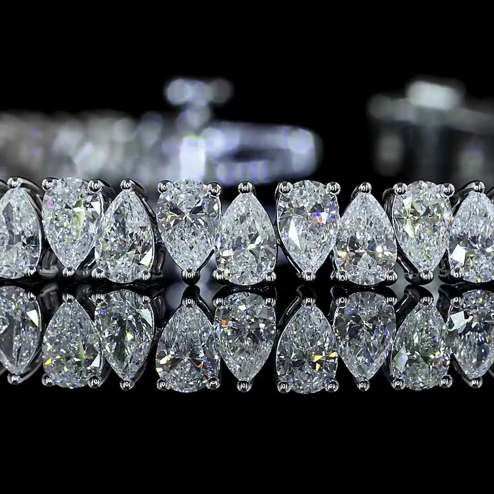 14K White Gold 7.54 Carat Tennis Bracelet with Prong Set Pear Cut Natural Diamonds (E-F Color, VS+ Clarity, 70 Stones) - Covaloro Fine Jewelry